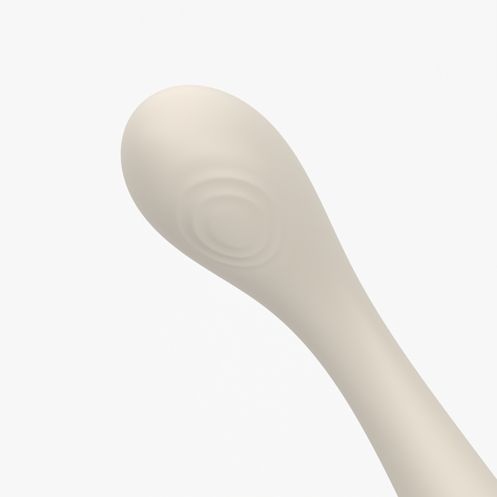 Close-up of Velvet Rituals Celeste massager tip on white background, showing targeted stimulation design in soft silicone