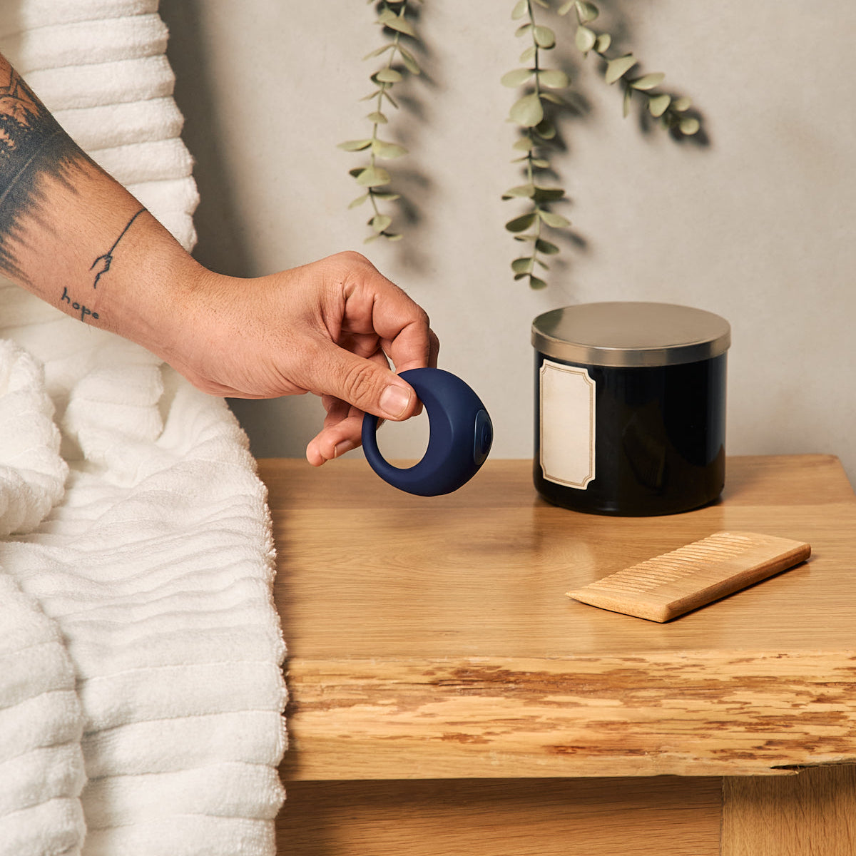 Orion wearable ring by Velvet Rituals held in hand in a calm, lifestyle setting, showcasing flexible fit and discreet everyday use