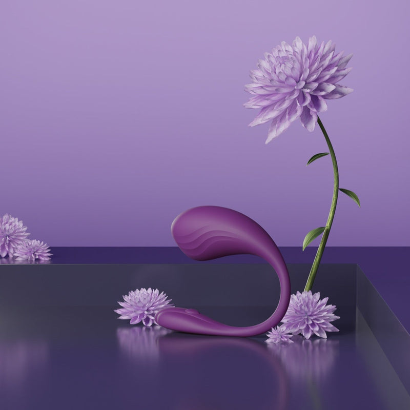 Naiomy by Velvet Rituals, an ergonomic curved pleasure massager showcased in a minimal purple lifestyle setting