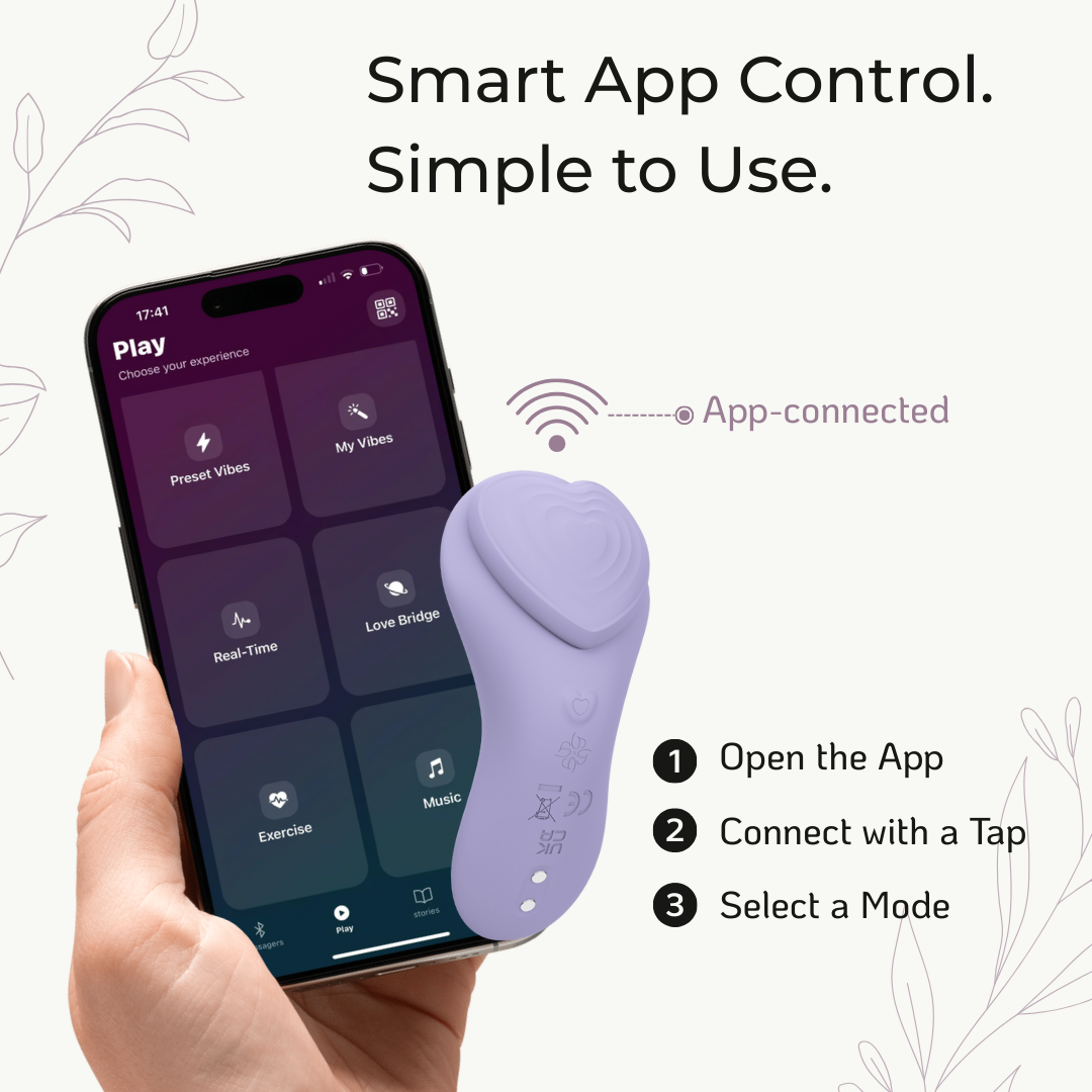 Velvet Rituals Whisper smart app control massager with smartphone displaying Velvet Vibes app interface and lavender device held by hand.