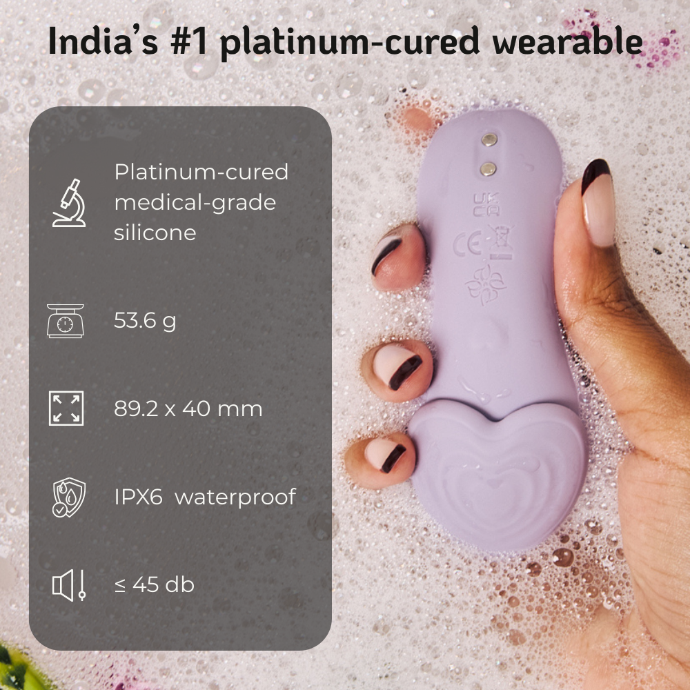Velvet Rituals Whisper wearable massager made from platinum-cured medical-grade silicone, lightweight, quiet, and waterproof, shown in hand with key specifications highlighted