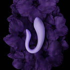 Velvet Rituals Eclipse app-controlled couples massager displayed on a deep purple floral background