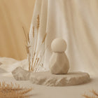 Velvet Rituals Estelle compact silicone massager displayed as a hero product shot with minimalist design and soft neutral background